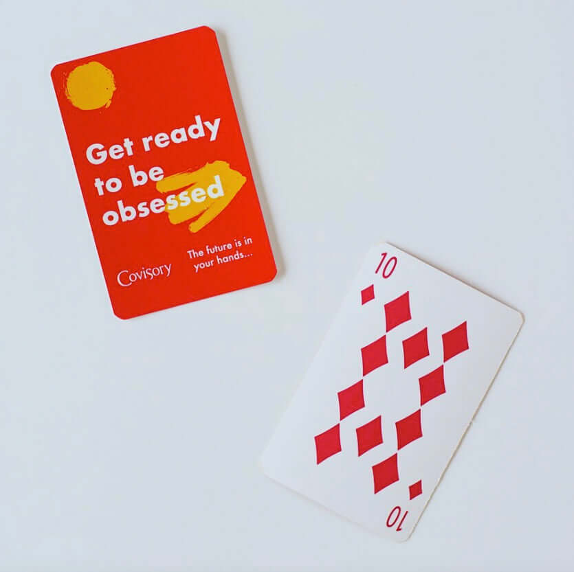 Custom poker-sized playing cards featuring a red promotional card and a ten of diamonds card on a white background.